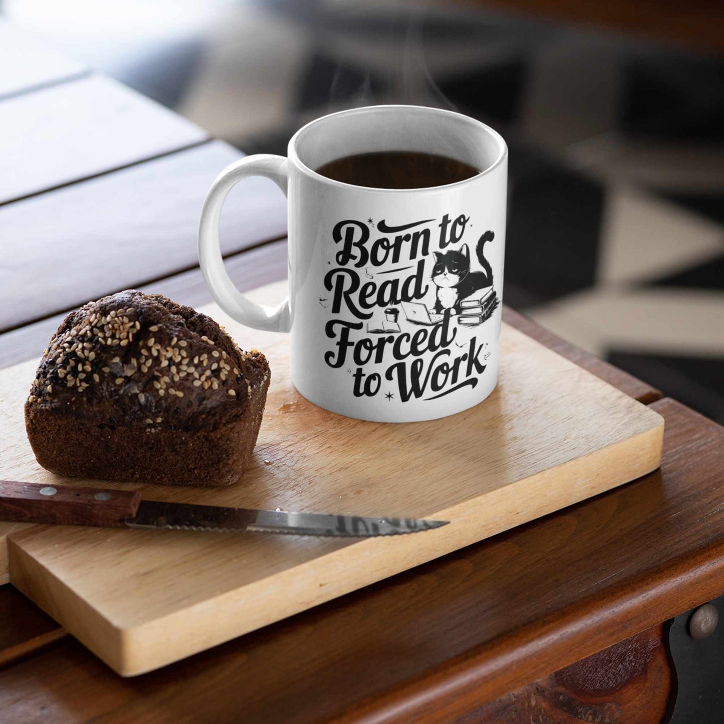 Born to read white mug on a chopping board with cake