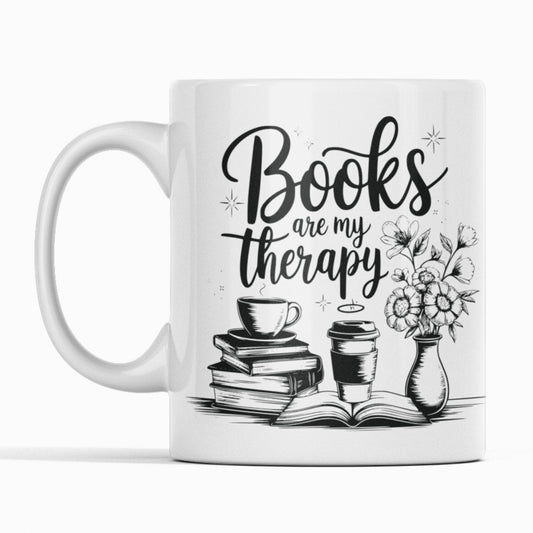 White mug black print. Pile of books, flowers coffee. Text Books are my therapy.