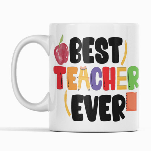 Best Teacher Ever white mug with apple  pencils and note book.