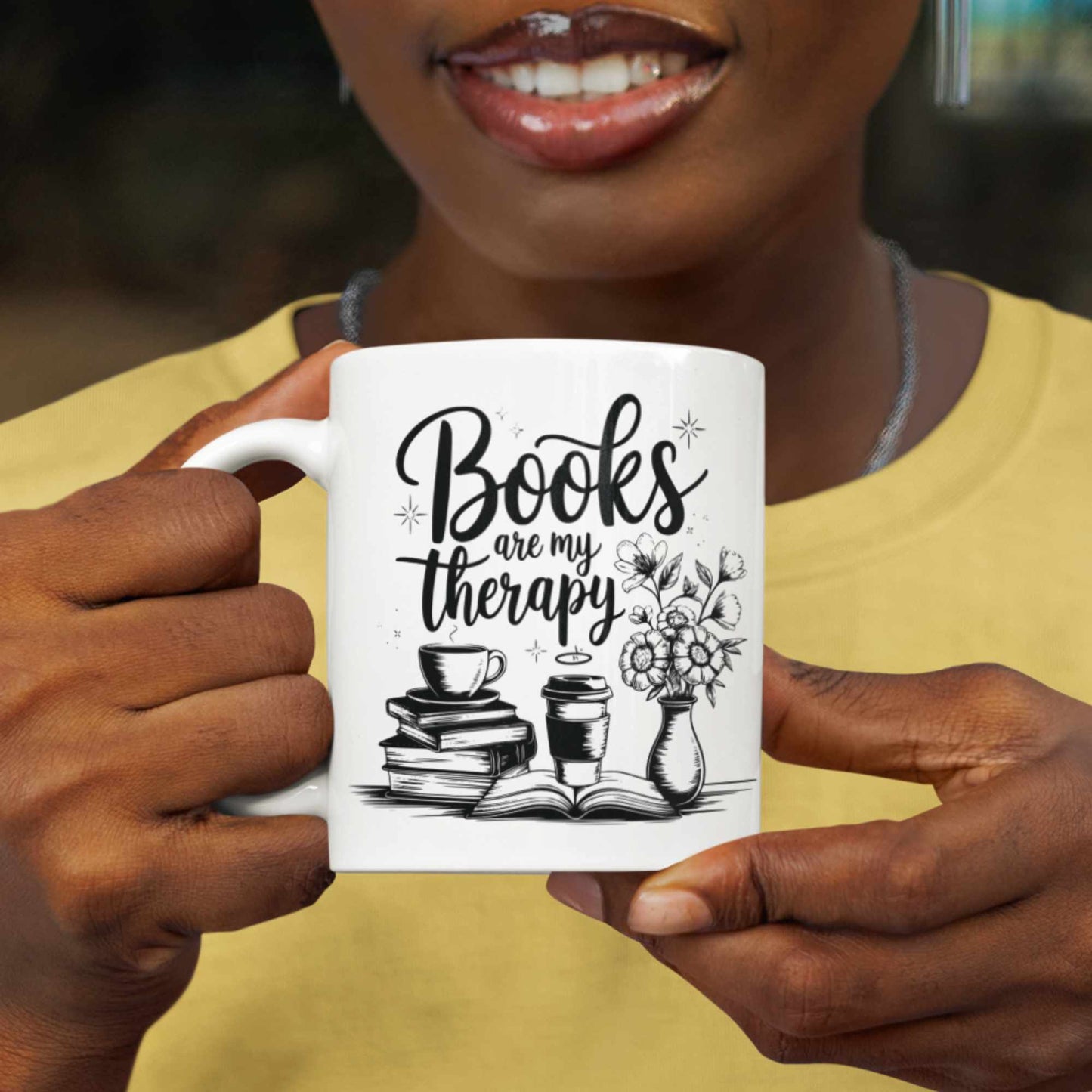 White mug hand held text books are my therapy. Design has books cups and flowers