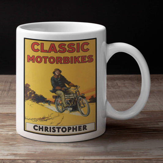 White mug with a graphic of a person on a motorcycle and text 'Classic Motorbikes Christopher' on a wooden surface.