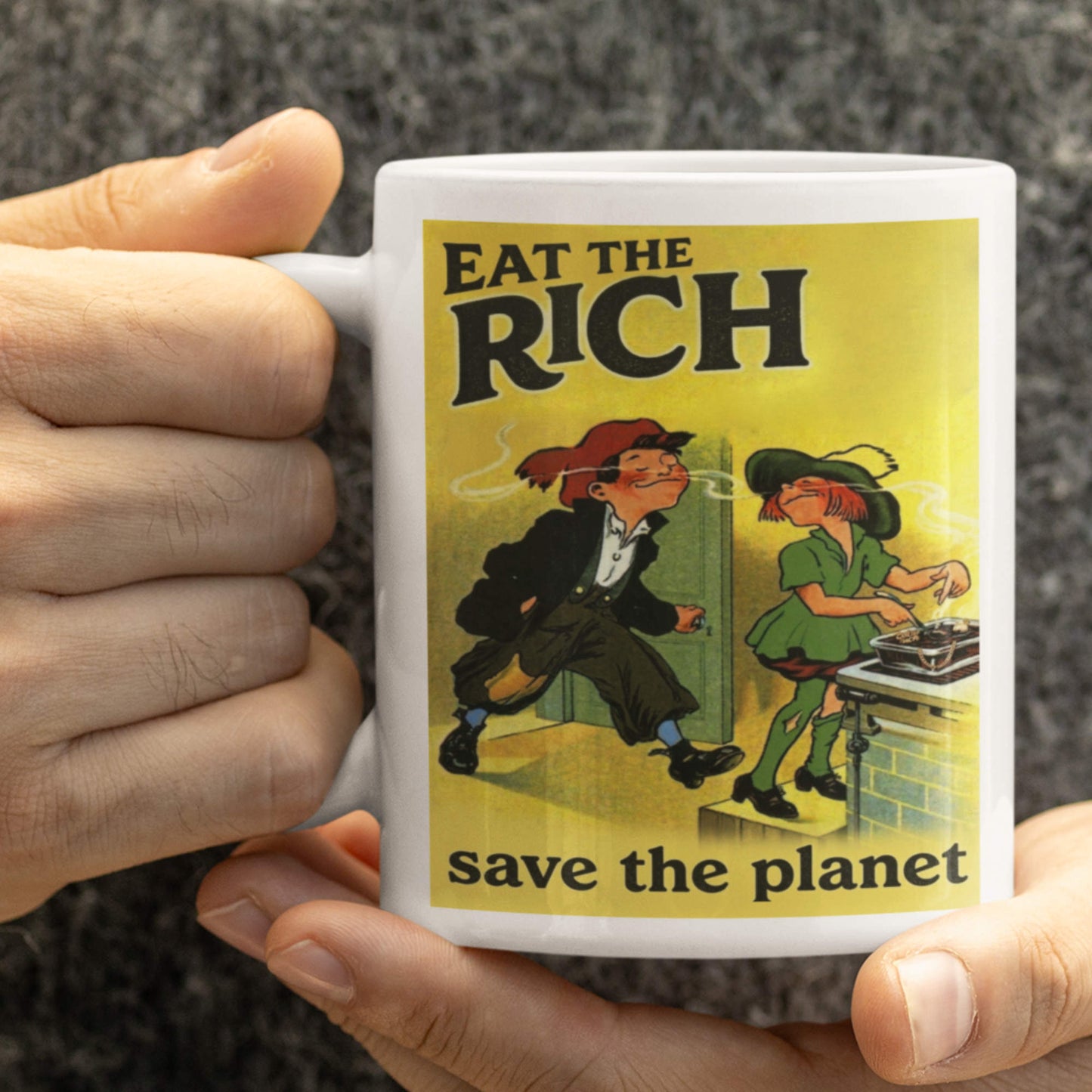 Mug with 'Eat the Rich, Save the Planet' design held by a person