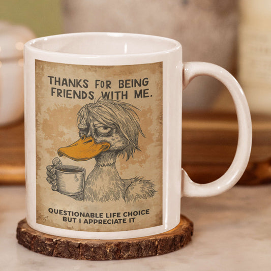Friendship mug with a duck illustration and humorous text on a wooden coaster.
