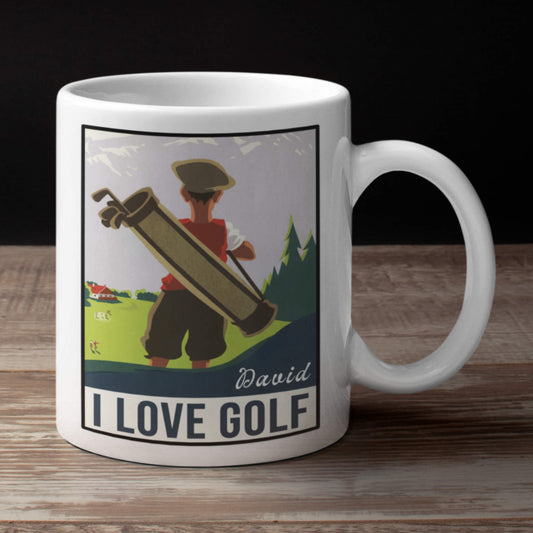 White mug with a graphic of a person holding a golf bag and text 'I Love Golf' on a wooden surface.