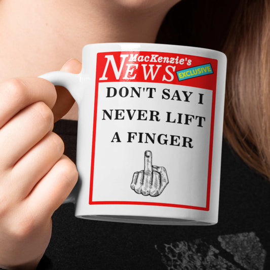 Mug with humorous design and text held by a person